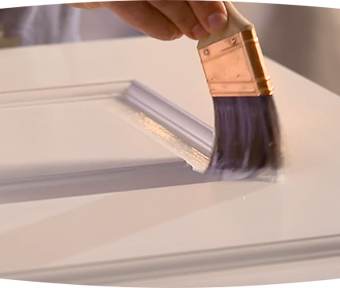 Person painting door trim