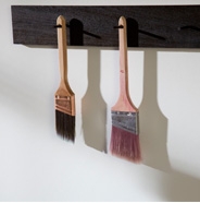 Hanging paint brushes to dry.