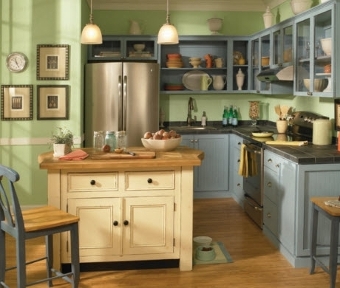Kitchen with blue cabinets and green colored walls