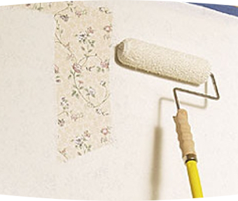 Paint roller painting over wallpaper