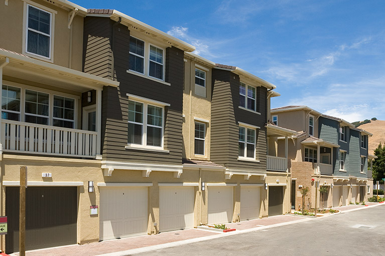 Small image of an exterior of a multi-family home properties next to each other.