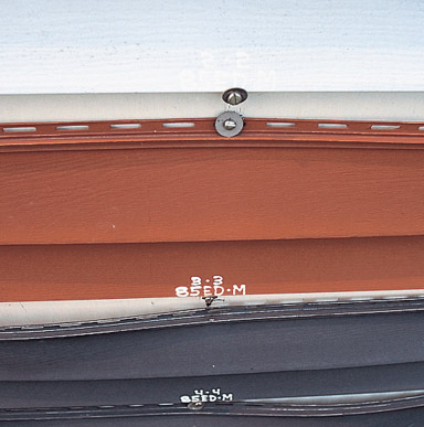 Close up image of a vinyl siding panels warping or buckling.