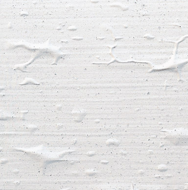 Close up image of a surface that is rough and has crinkled painted surface.