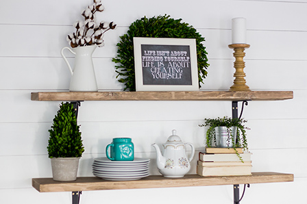 shiplap wall with shelving and decor