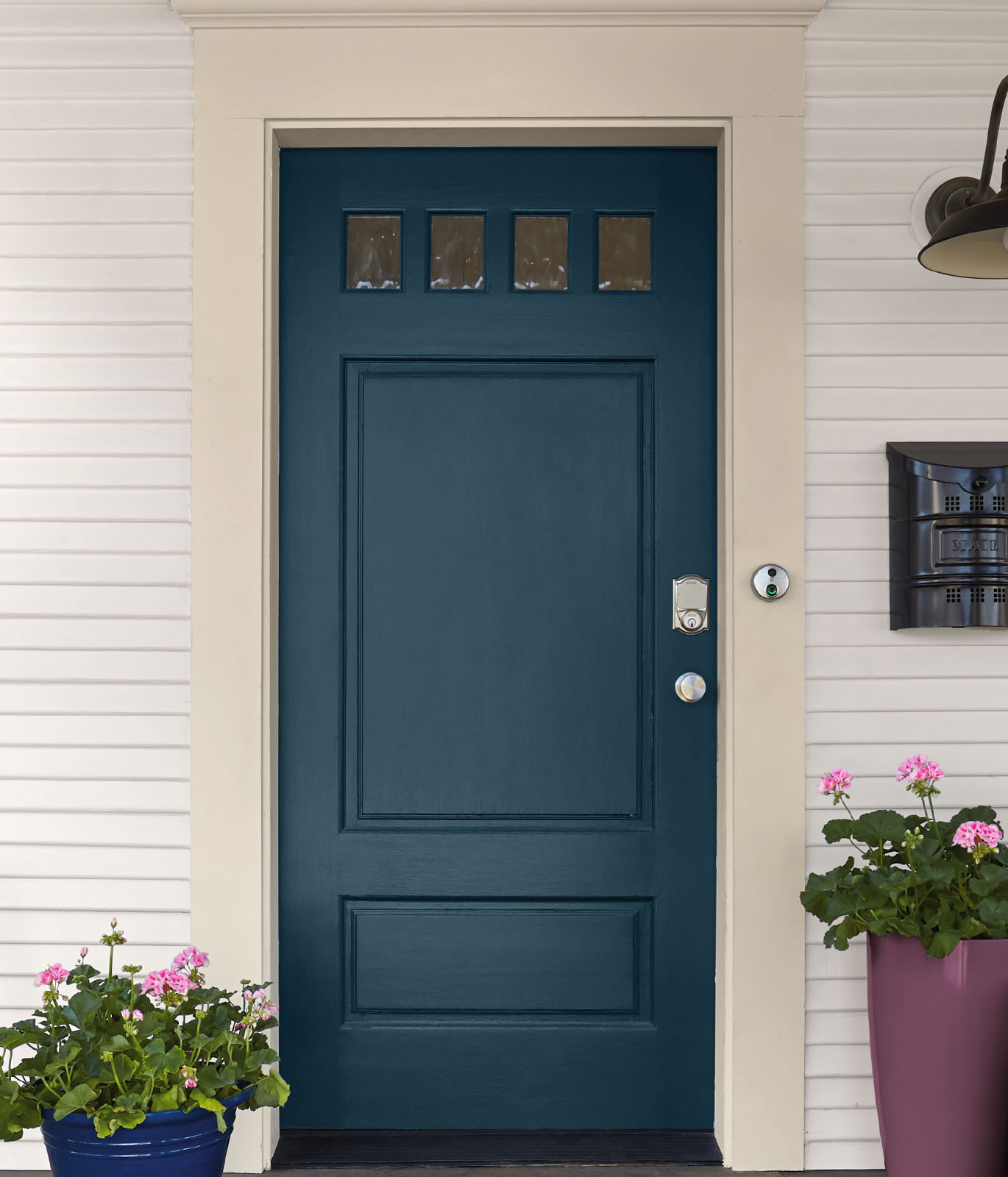 An exterior front door painted in blue.